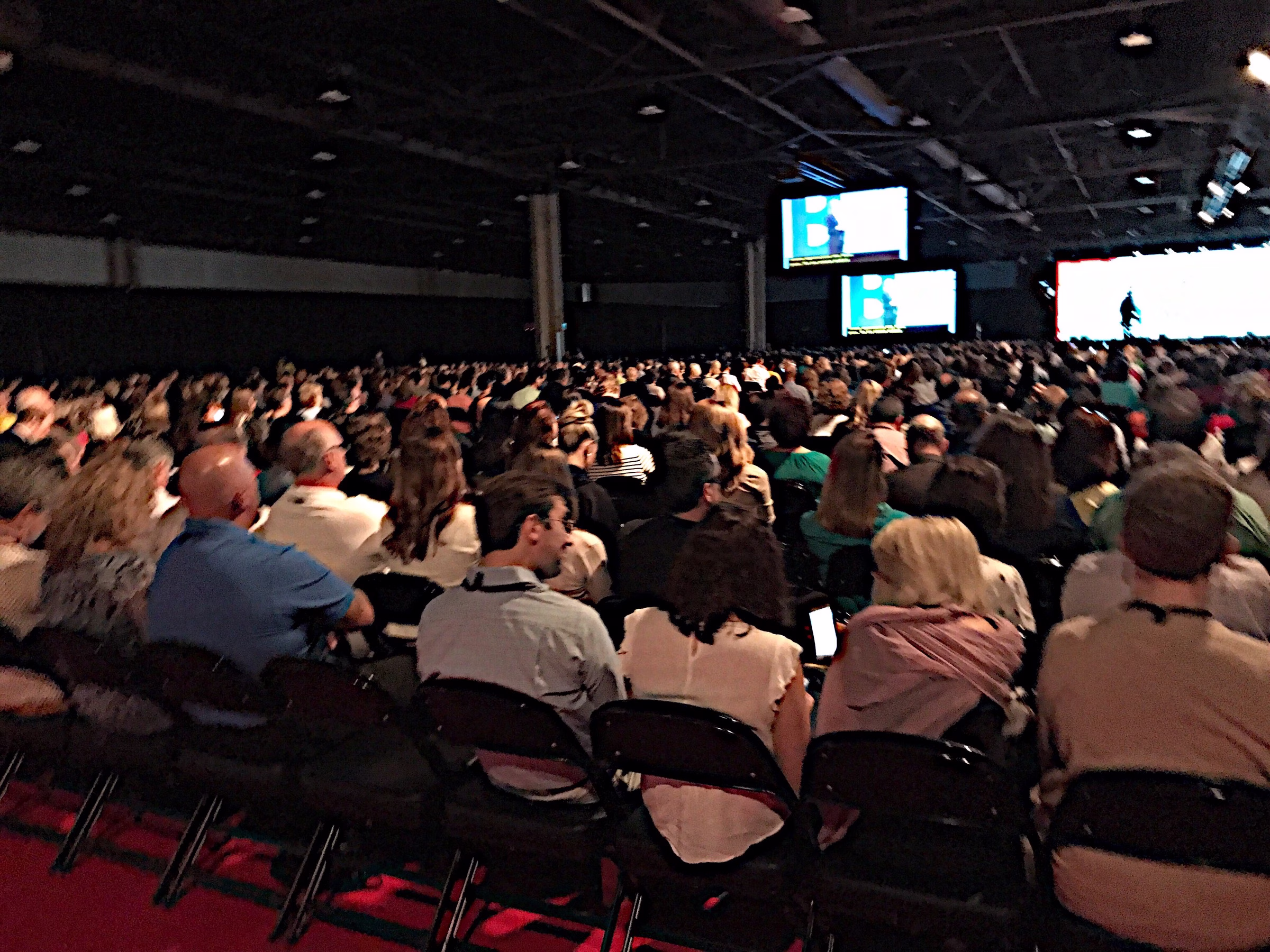corporate conference video production led screens auditorium triangle - Audio/Video Services for Corporate Events in the Triangle Large corporate conference audience viewing LED video screens during keynote presentation with professional AV production