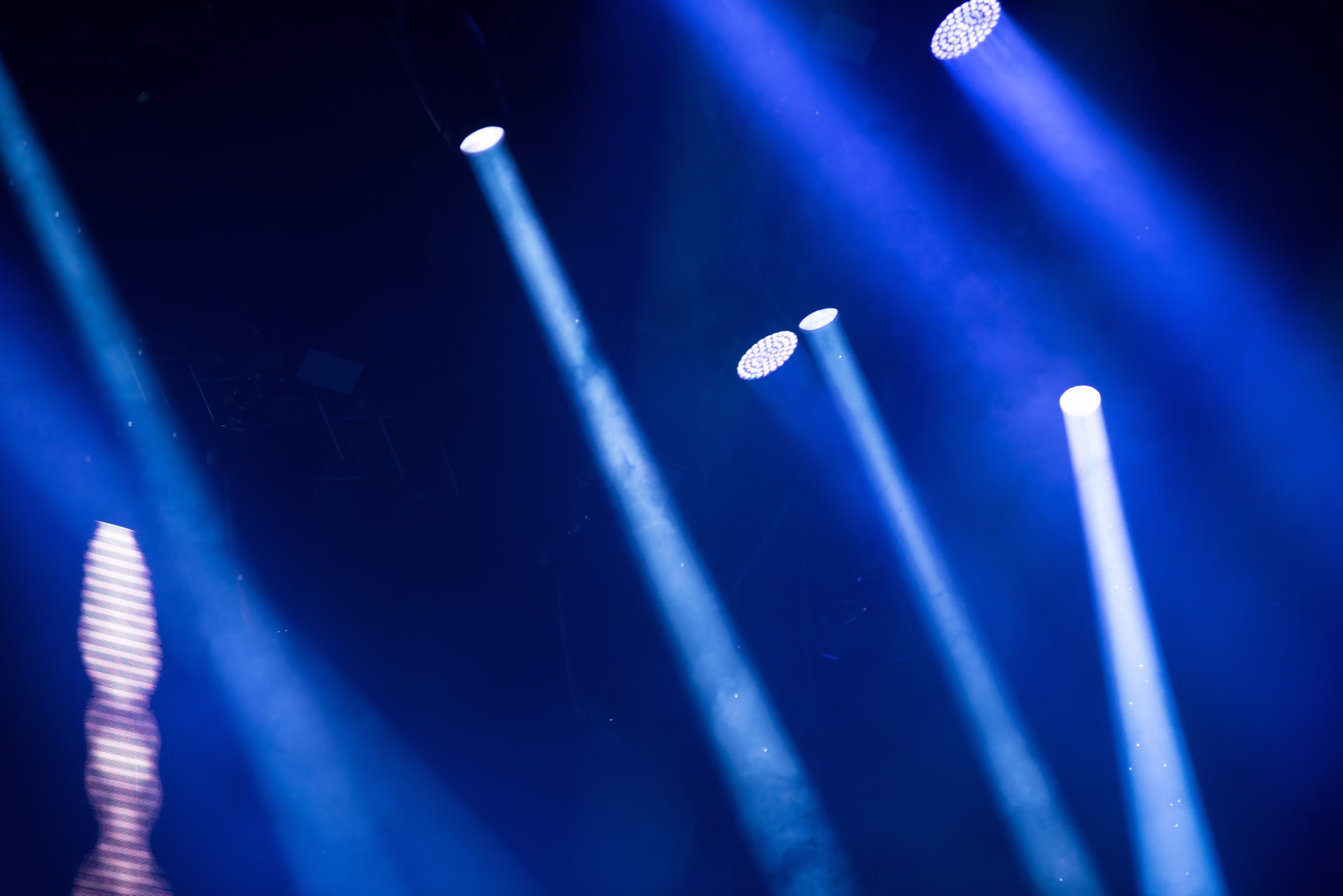 corporate event lighting design blue spotlights stage production raleigh - Audio/Video Services for Corporate Events in the Triangle Stage lighting