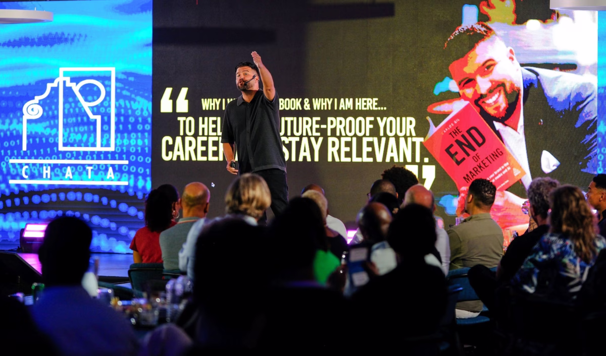 keynote speaker led screen presentation corporate conference raleigh - Audio Keynote speaker presenting on stage with large LED video wall displaying 'The End of Marketing' book promotion and career relevance messaging at a corporate conference event